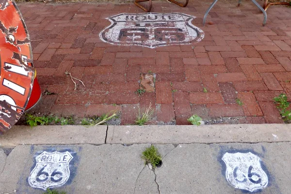 stock image Erick, OK, USA. June 7, 2014. Route 66 Signs on the sidewalk outside The Sandhills Curiosity Shop. 