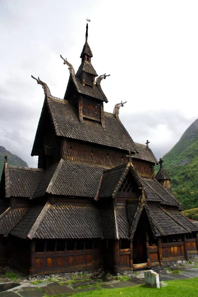 stock image Borgund Stave Church surronded by mountains. Borgund, Norway, September 14, 2015. 