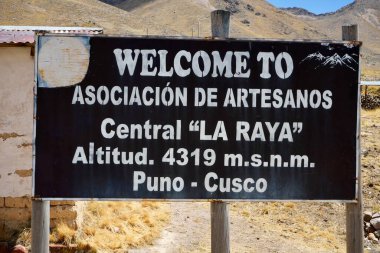 Sign for The Association De Artesanos Market at La Raya. La Raya, Cusco, Peru, October 8, 2023.  clipart