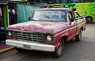 Vintage rusty red Ford F100 pickup truck, Iguaz, Misiones Province, Argentina. October 25, 2023.  clipart