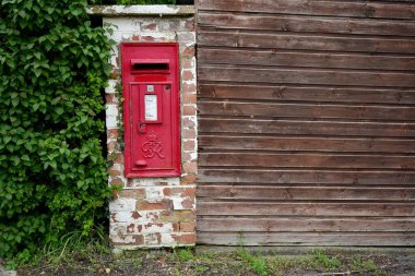 Vintage Red British post box from the reign of King George VI (1936-1952), Goulceby, Louth, UK. April 12, 2024.  clipart