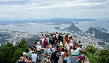 Tourists taking selfies of the View of Rio from the base of The Statue of Christ The Redeemer. Rio de Janeiro, Brazil, October 28, 2023.  clipart