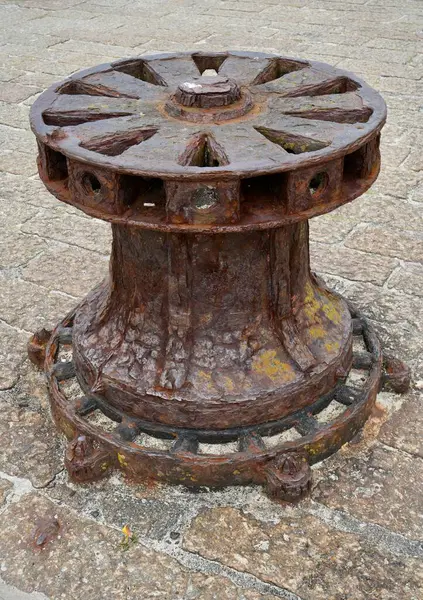 stock image Old rusty metal windlass on the pier. St Ives, Cornwall, England, UK. July 19, 2024. 