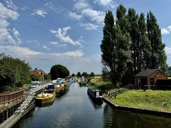 stock image Beeston Canal with moored barges under a blue sky. Beeston, Nottingham, England, UK.August 12, 2024. 