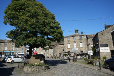 Grassington Village Square in the sunshine. Grassington, North Yorkshire, England,UK. August 14, 2024.  clipart