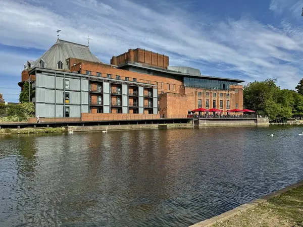 stock image The Swan Theatre on The River Avon under a blue sky. Stratford-upon-Avon, England, UK. August 28, 2024. 