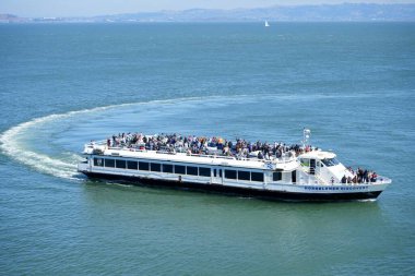 Passenger ferry Hornblower Discovery arriving at Alcatraz Island, San Francisco, CA, USA. September 2024.  clipart