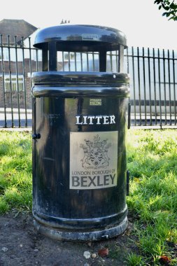 Black public litter bin from The London Borough of Bexley. Bexley, London, UK. October 2024.  clipart