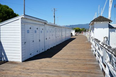 Row of white numbered sheds at Sausalito Yacht Harbor, Sausalito, California, USA. September 2024.  clipart