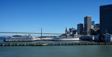 The ships San Francisco Belle and Santa Rosa with the Bay Bridge and City skyline. San Francisco, California, USA. September 2024.  clipart