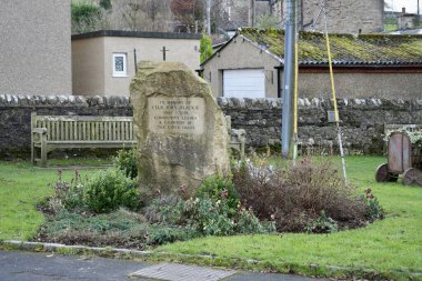 Memorial stone for Cllr John Blackie in Hawes, North Yorkshire, England, UK. November 2024.  clipart