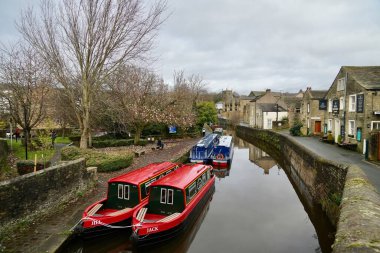 Narrowboats on The Leeds and Liverpool Canal by The Royal Shepherd Pub. Skipton, North Yorkshire, England, UK. November 2024.  clipart