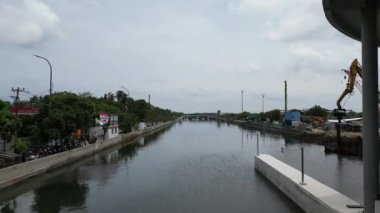 construction of a polder pump system building that connects the river and the sea