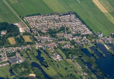 Aerial view of the town Nederhorst den Berg in the Netherlands. Part of the lake is visible as well as dairy meadows and legakkers. High quality photo