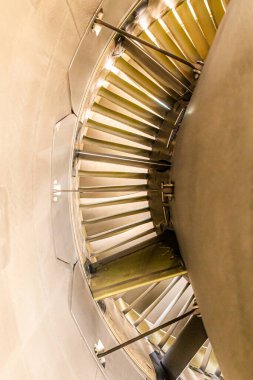 Interior stator vanes and frond fan of a jet engine .Golden light reflecting on the aluminium components. High quality photo