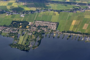 Aerial view of the town Nederhorst den Berg in the Netherlands. Part of the lake, Spiegelplas, is visible as well as dairy meadows and legakkers. High quality photo
