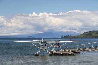 Two waterlines moored at a pier at Lake Taupo, New Zealand. Impressive sky and clam water. High quality photo