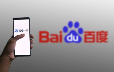Dhaka, Bangladesh - 18 December 2023: Ernie Bot is an AI chatbot service product of Baidu. clipart