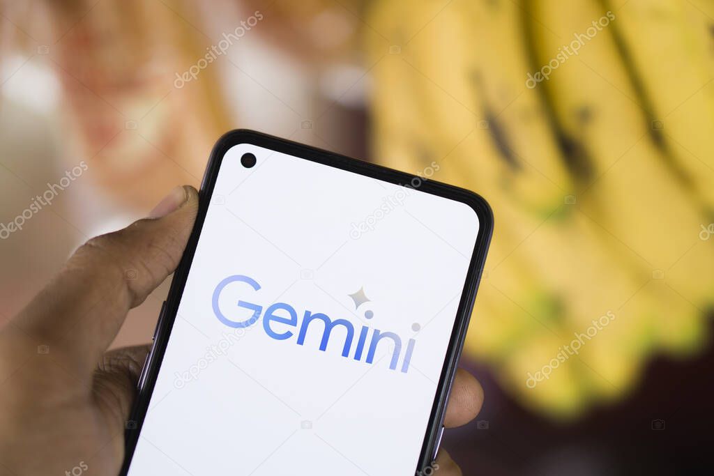 Dhaka, Bangladesh - 27 December 2023: Hand holding a phone with Google Gemini AI chatbot Gemini is a family of multimodal large language models developed by Google.
