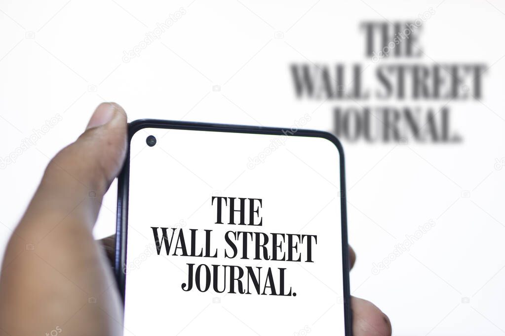 Dhaka, Bangladesh - 11 January 2024: The Wall Street Journal logo on the smartphone. The Wall Street Journal is an American business and economic focused international daily newspaper.
