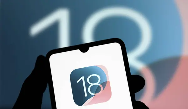 stock image Dhaka, Bangladesh- 14 June 2024: Apple IOS 18 logo is displayed on smartphone.