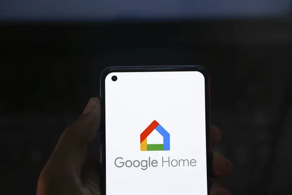 stock image Dhaka, Bangladesh- 23 July 2024: Google Home logo is displayed on smartphone.