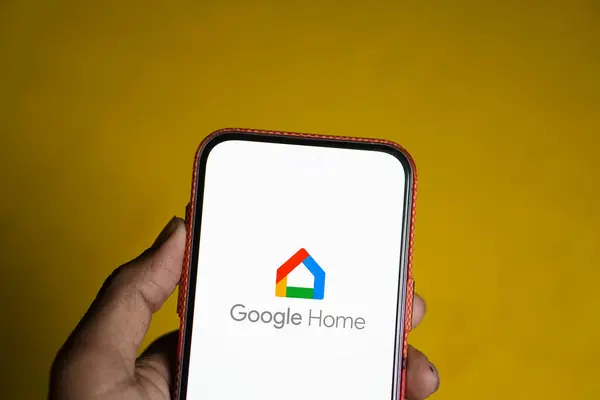 stock image Dhaka, Bangladesh- 23 July 2024: Google Home logo is displayed on smartphone.