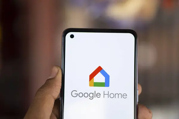 stock image Dhaka, Bangladesh- 23 July 2024: Google Home logo is displayed on smartphone.