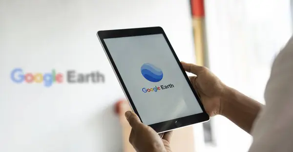 stock image Dhaka, Bangladesh- 23 July 2024: Google Earth logo is displayed on iPad.