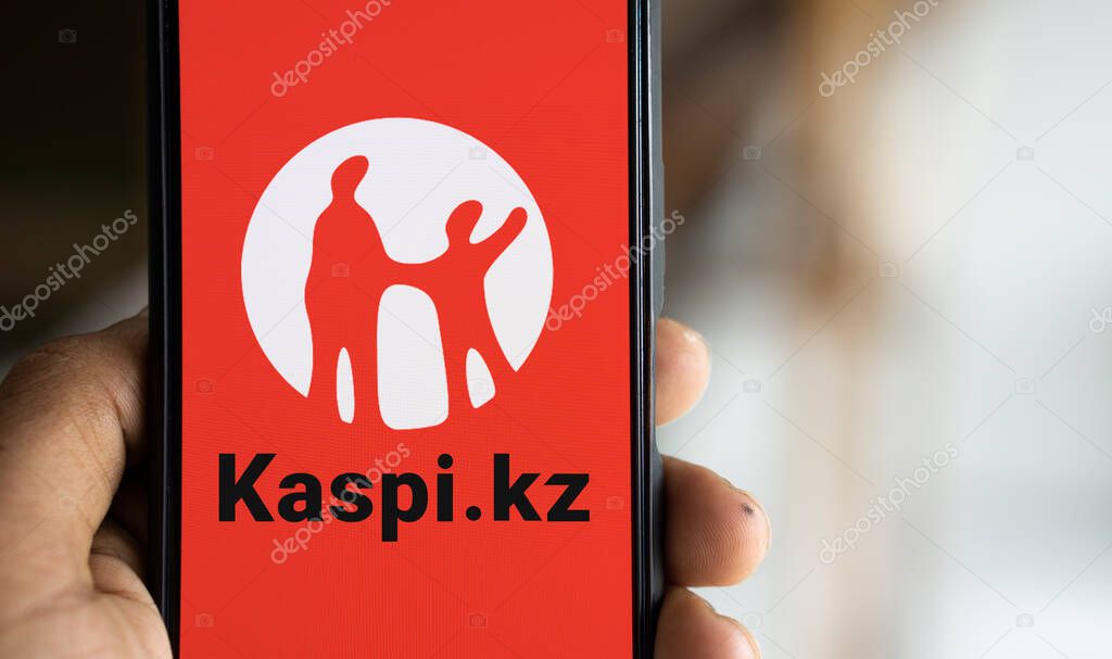 Dhaka, Bangladesh- 08 Aug 2024: Kaspi.kz AO logo is displayed on smartphone.