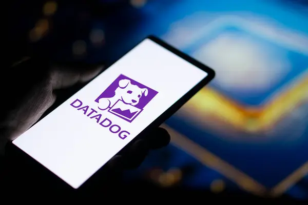 stock image Dhaka, Bangladesh- 11 Aug 2024: DataDog logo is displayed on smartphone. Datadog is a SaaS platform that monitors cloud applications.