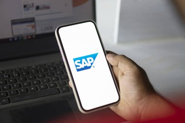 Dhaka, Bangladesh- 11 Aug 2024: Sap Se logo is displayed on smartphone. SAP SE is a German multinational software company. clipart