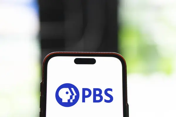 stock image Dhaka, Bangladesh- 15 Aug 2024: PBS logo is displayed on smatphone. PBS is America's non-profit public television network.