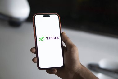 Dhaka, Bangladesh- 23 Sep 2024: Telus logo is displayed on smartphone. clipart