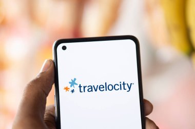 Dhaka, Bangladesh- 26 Sep 2024: Travelocity logo is displayed on smartphone. clipart