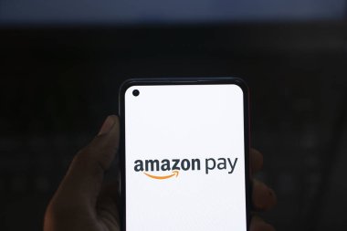 Dhaka, Bangladesh- 26 Sep 2024: Amazon Pay logo is displayed on smartphone. clipart