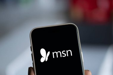 Dhaka, Bangladesh- 29 Sep  2024: msn logo is displayed on smartphone. clipart