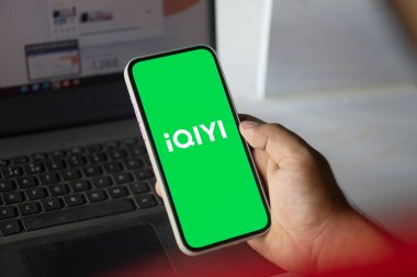 Dhaka, Bangladesh- 01 Oct 2024: iQIYI logo is displayed on iPad. clipart