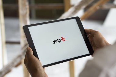 Dhaka, Bangladesh- 15 Oct 2024: Yelp  logo is displayed on iPad. clipart