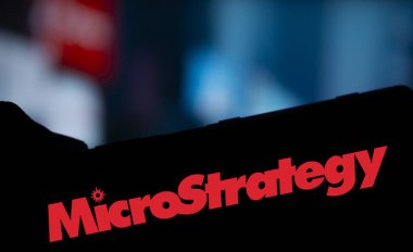 Dhaka, Bangladesh- 24 Oct 2024: MicroStrategy logo is displayed on smartphone. clipart