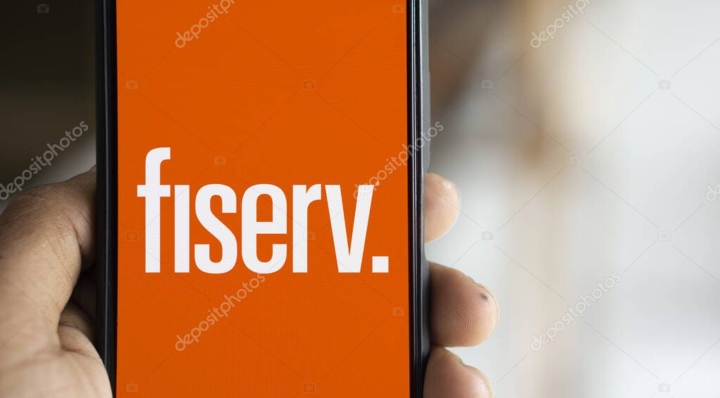 Dhaka, Bangladesh- 31 Oct 2024: Fiserv logo is displayed on smartphone.