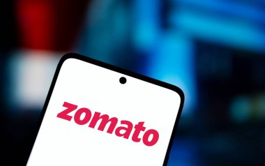 Dhaka, Bangladesh- 02 Nov 2024: Zomato logo is displayed on smartphone. clipart