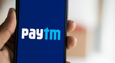 Dhaka, Bangladesh- 02 Nov 2024: Paytm logo is displayed on smartphone. clipart