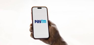 Dhaka, Bangladesh- 02 Nov 2024: Paytm logo is displayed on smartphone. clipart