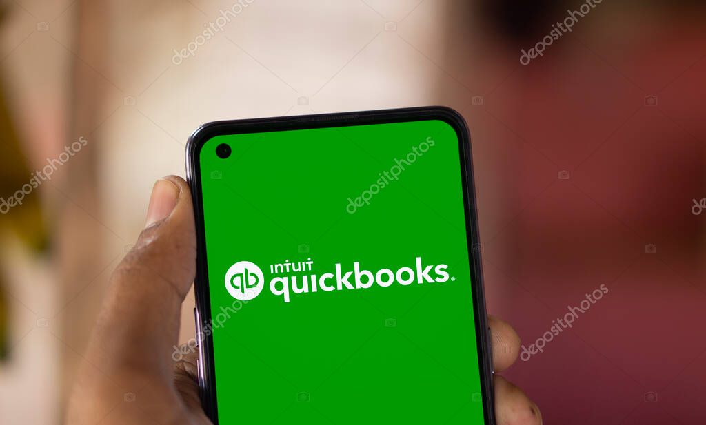Dhaka, Bangladesh- 15 Oct 2024: Intuit quickbooks logo is displayed on smartphone. QuickBooks is an accounting software.