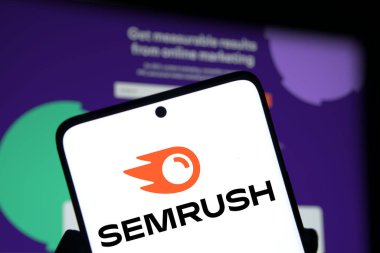 Dhaka, Bangladesh- 17 Nov 2024; Semrush logo is displayed on smartphone. Semrush is a SaaS platform for digital marketing and SEO. clipart