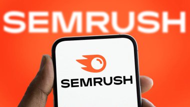 Dhaka, Bangladesh- 17 Nov 2024; Semrush logo is displayed on smartphone. Semrush is a SaaS platform for digital marketing and SEO. clipart