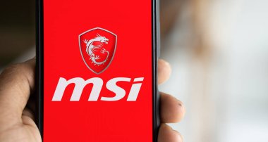 Dhaka, Bangladesh- 17 Nov 2024: Msi logo is displayed on smartphone. MSI is a Taiwanese multinational information technology company. clipart