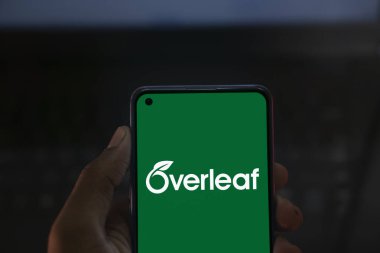 Dhaka, Bangladesh- 26 Nov 2024: Overleaf logo is displayed on smartphone. Overleaf is a cloud-based LaTeX editor for scientific writing and publishing. clipart