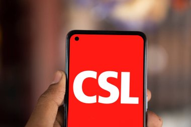 Dhaka, Bangladesh- 28 Nov 2024: CSL logo is displayed on smartphone. CSL Limited is an Australian biotechnology company. clipart